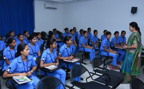 a classroom full of nursing students with their tutor